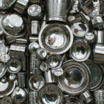A photograph, taken from above, of several kinds of metal utensils