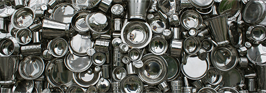 A photograph, taken from above, of several kinds of metal utensils