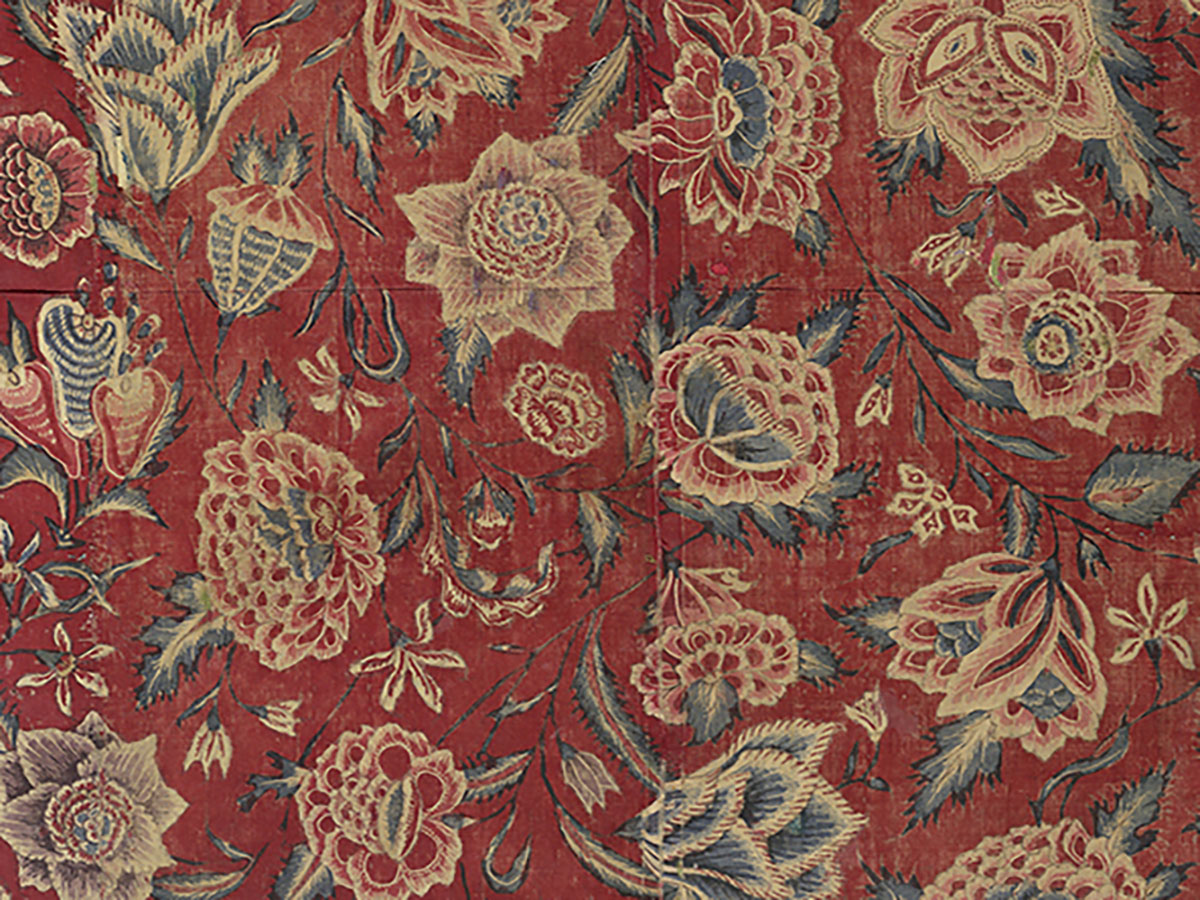 A Chintz textile with depictions of a variety of flowers.