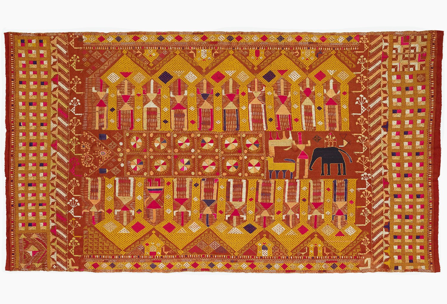 Embroidered textile showing two rows of figures under archways. Human, animal and floral symbols in the centre and the border.