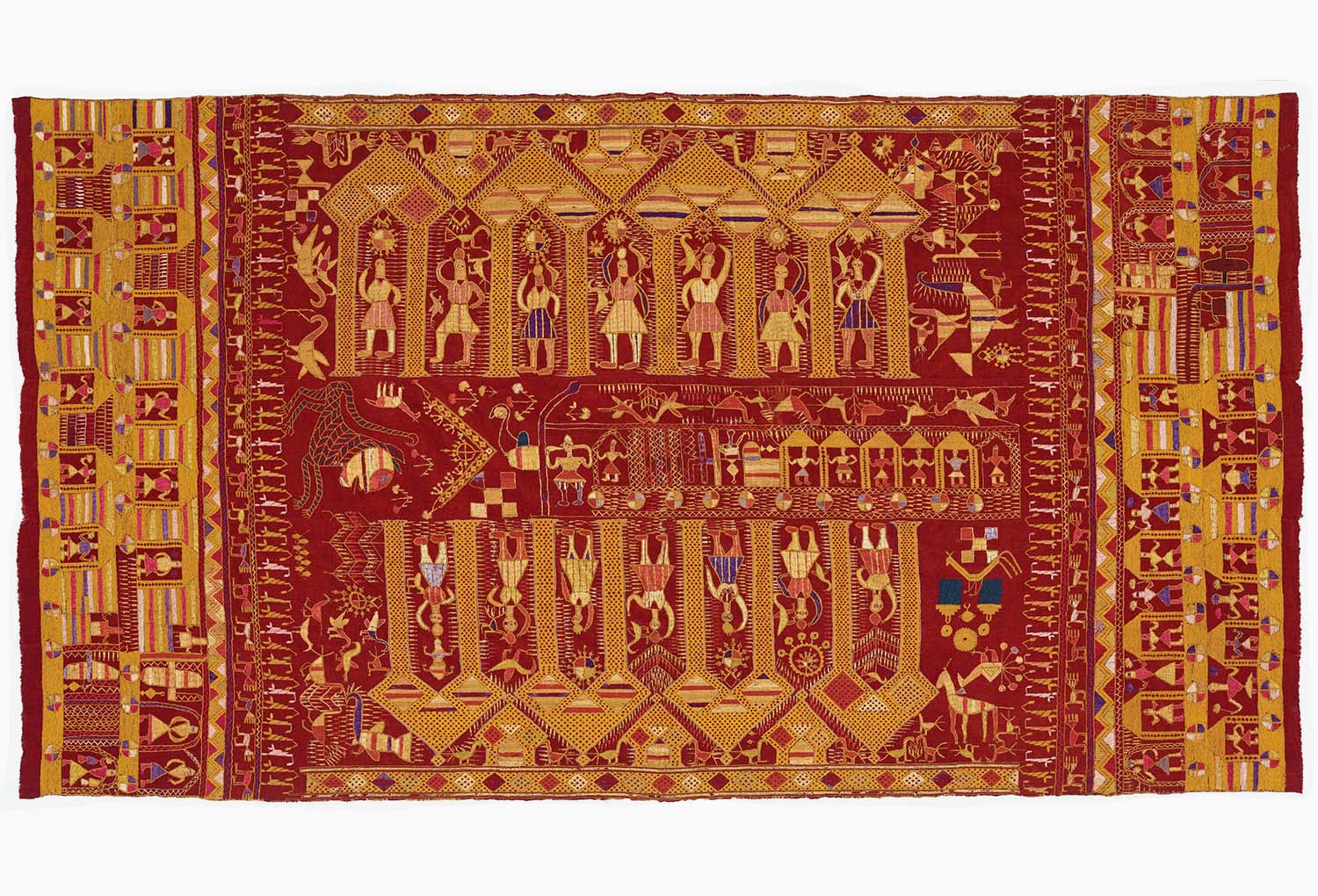 Embroidered textile showing two rows of figures under a colonnade. A tram full of people and animals moves through the centre.