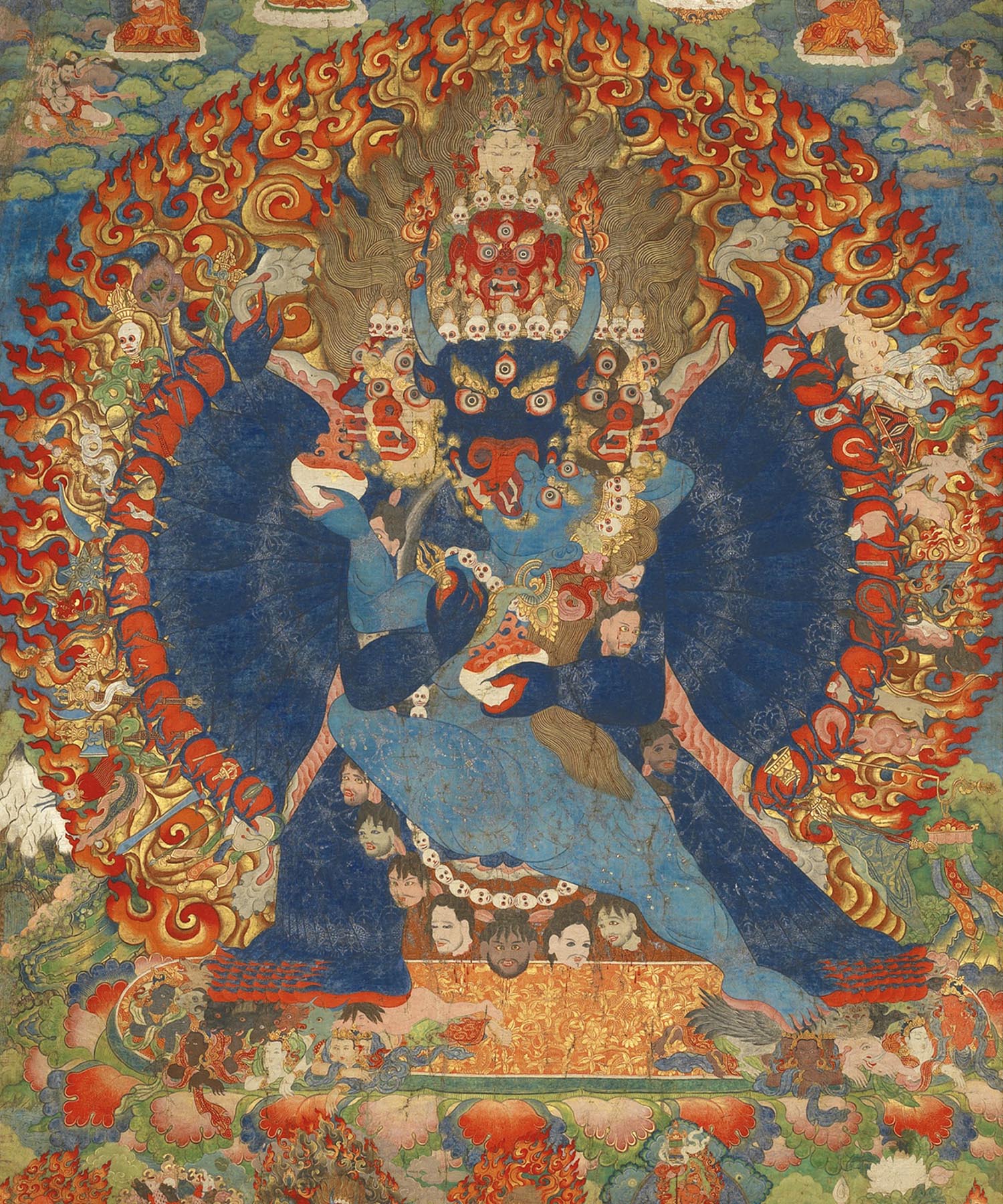 A Buddhist thangka with a central image of Vajrabhairava encircled by a halo of flames