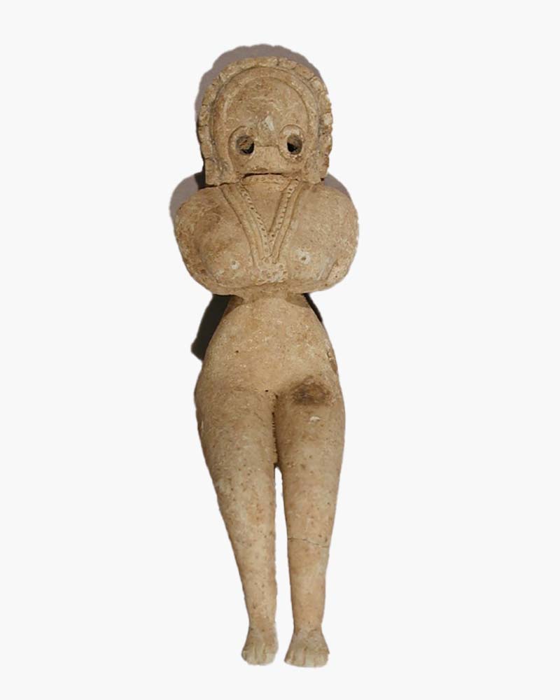 A standing terracotta figurine of a fertility or mother goddess with voluptuous features.