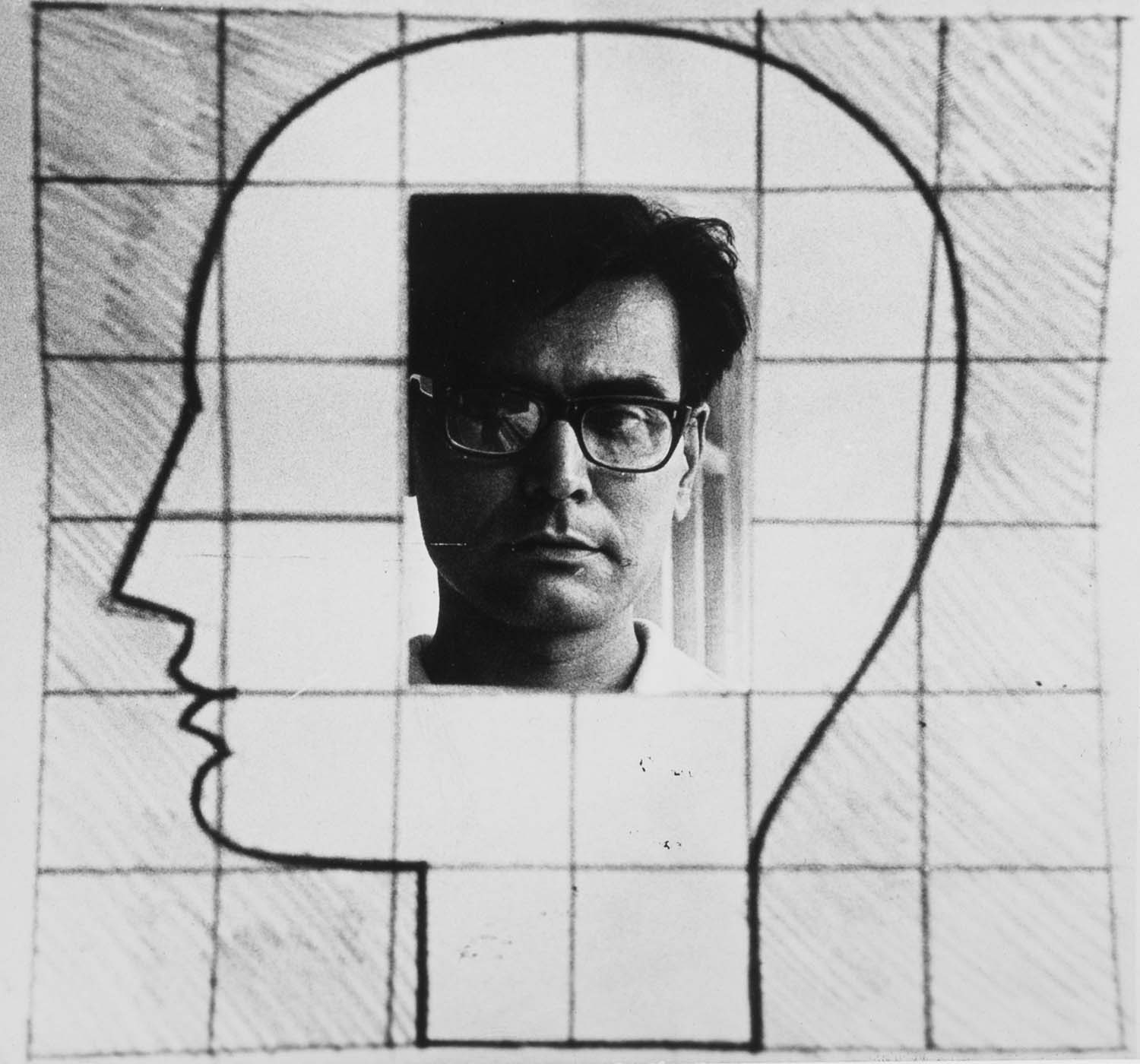 A photographed self-portrait of the artist inside a line drawing of a human head in profile, drawn over a grid on paper.
