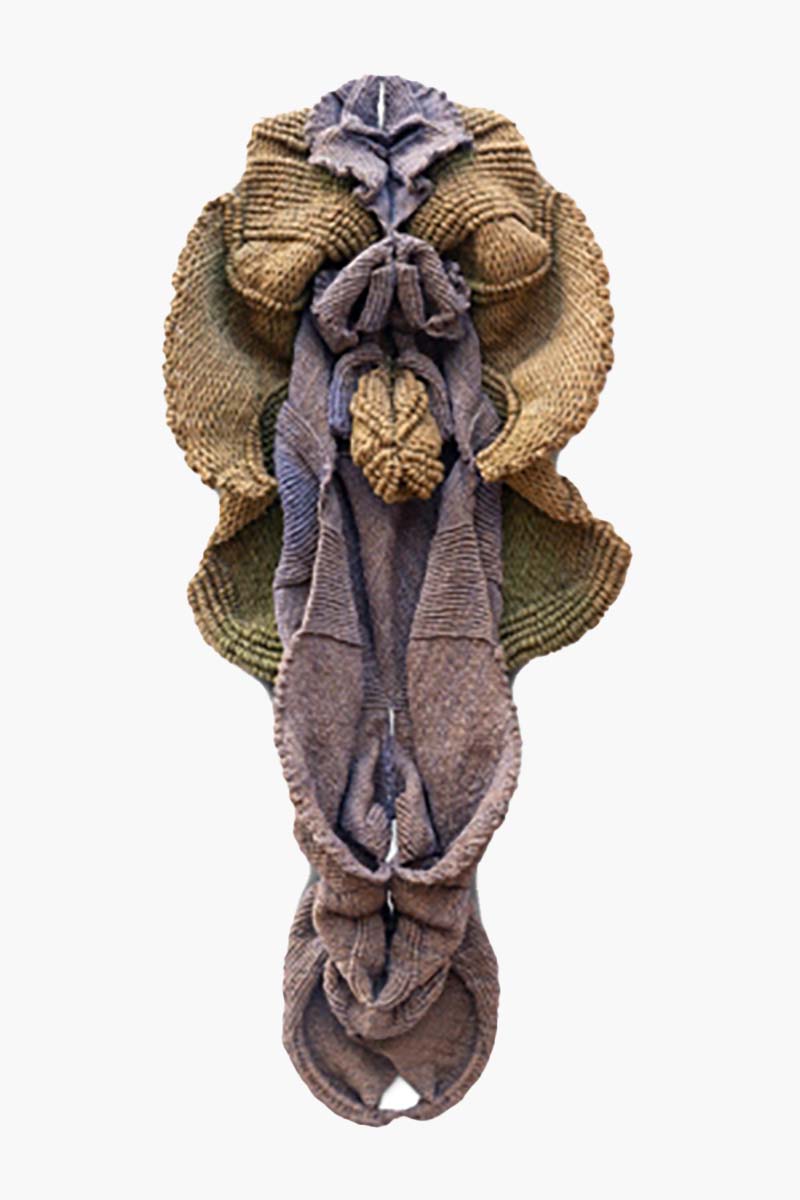 A hemp and jute sculpture that evokes the hooded head and the elongated body of a snake.