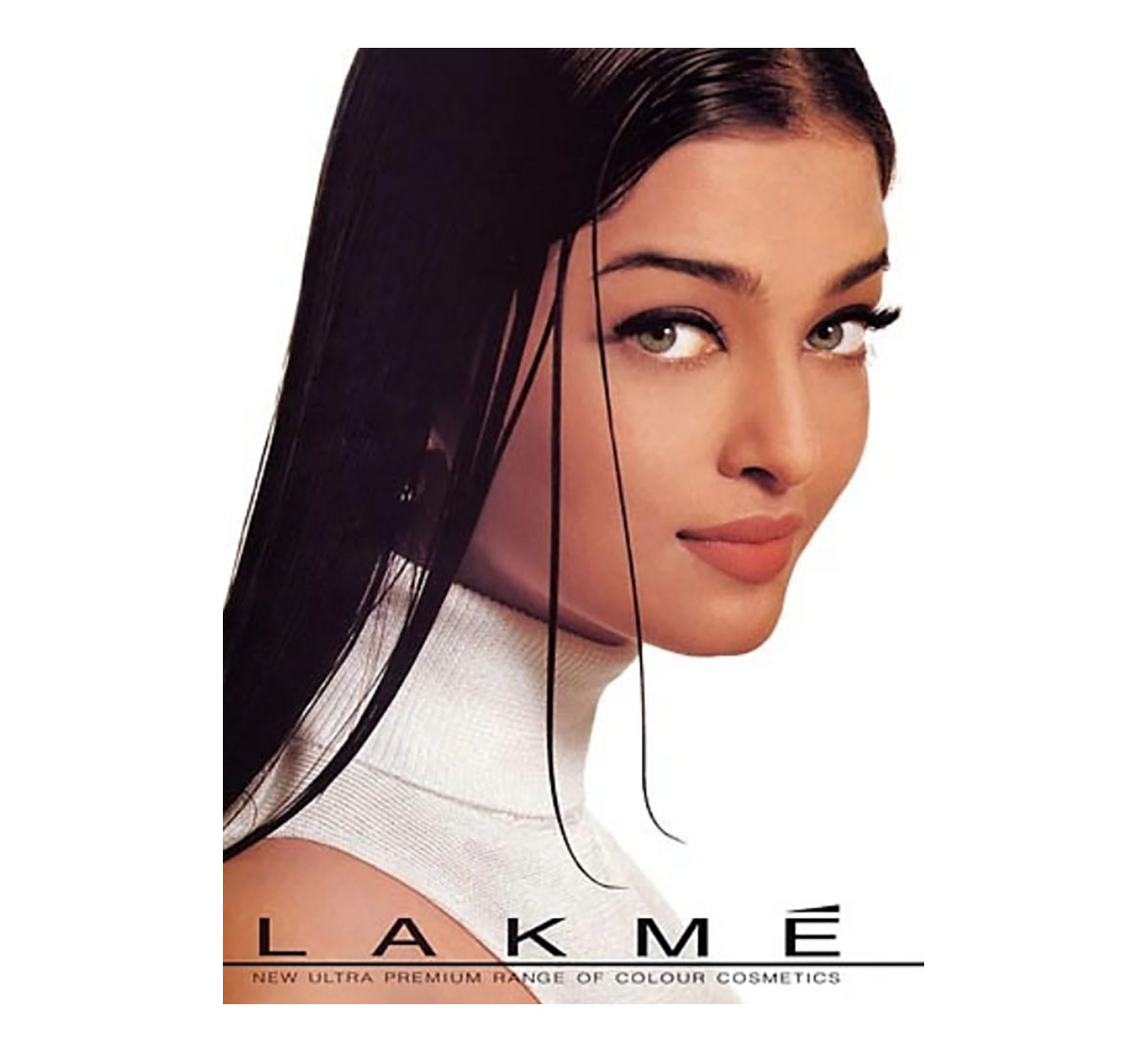 A woman (Aishwarya Rai) wearing a white sleeveless high-neck top with wet sleek hair is pictured from her right.