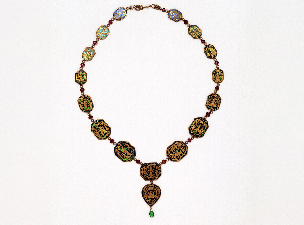 Photograph of a necklace with sixteen plaques featuring gold thewa on green and blue glass illustrating deities and floral motifs