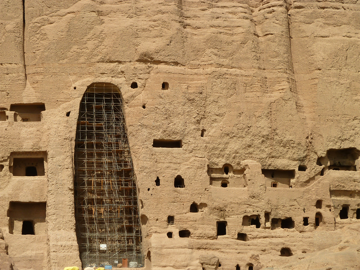 Photograph showing scaffolding installed in one the empty niches of Bamiyan as part of the restoration efforts