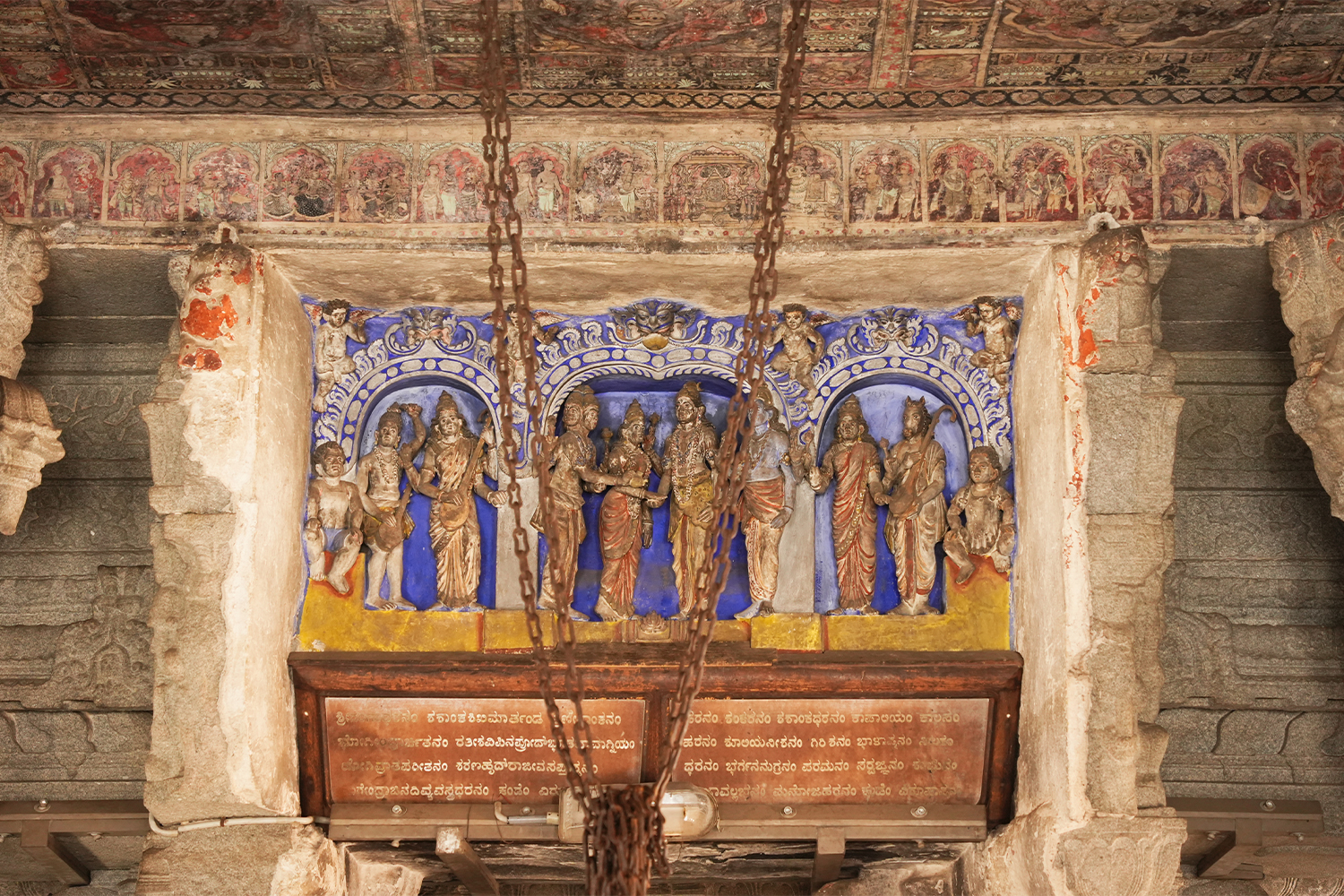 Photograph of the lintel above the entrance to the main shrine of the Virupaksha Temple showing various painted deities