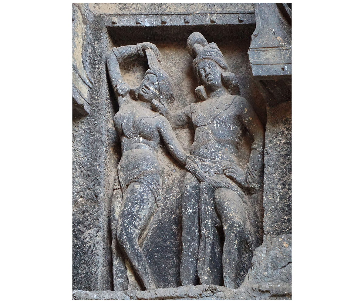 Photograph of a mithuna relief at Karle Caves